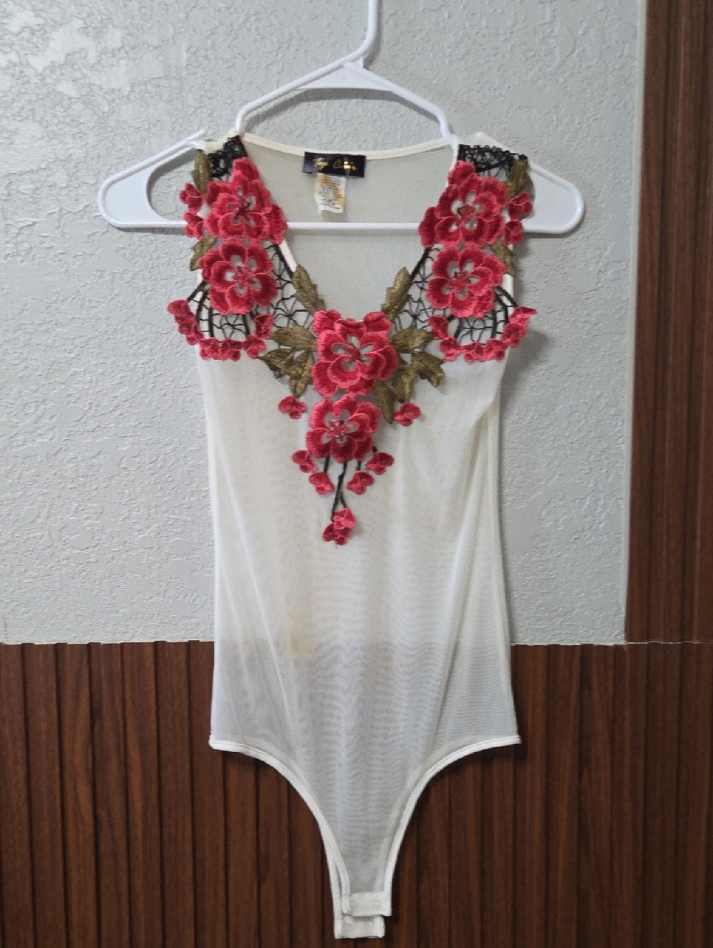 White Sheer Mesh Bodysuit with Pink & Gold Floral Lace Applique. [0032]